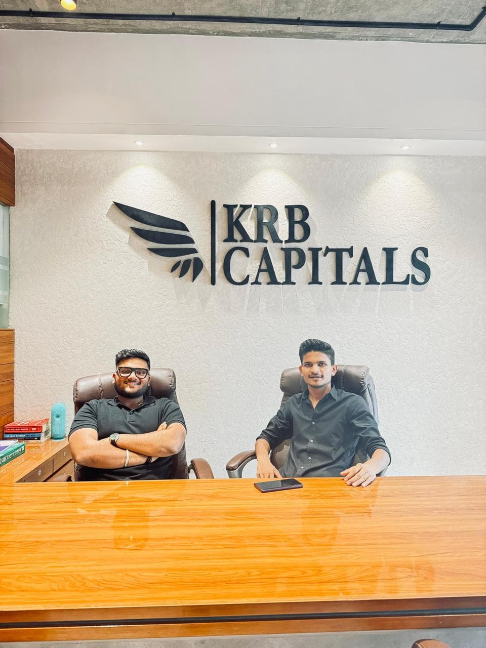 Ramsingh Vaghelaa and a colleague seated at the KRB Capitals office