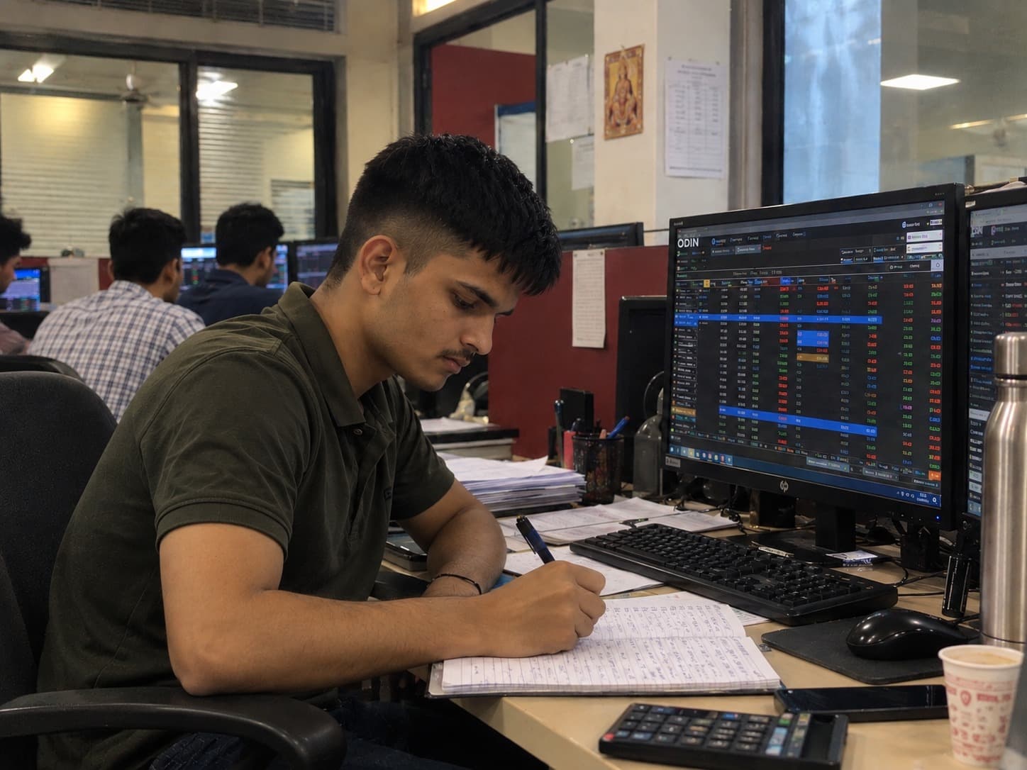Ramsingh Vaghelaa working at a live trading desk